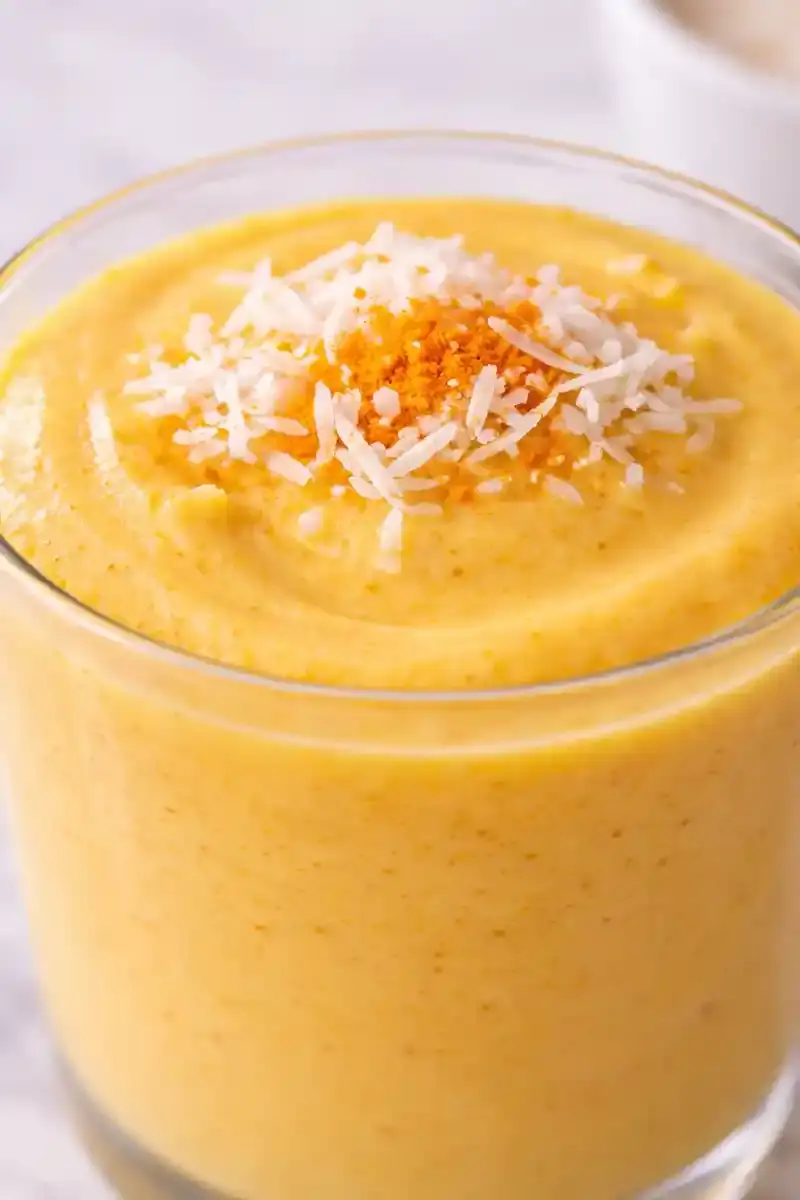Mango turmeric smoothie texture close-up Close-up of mango turmeric smoothie showing creamy texture