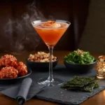 filthy kimchi martini cocktail on bar with garnish