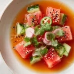 Elegant hamachi crudo served with cilantro and sesame
