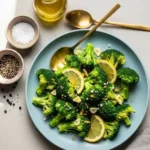 Plated steamed broccoli ready to serve with garlic lemon dressing